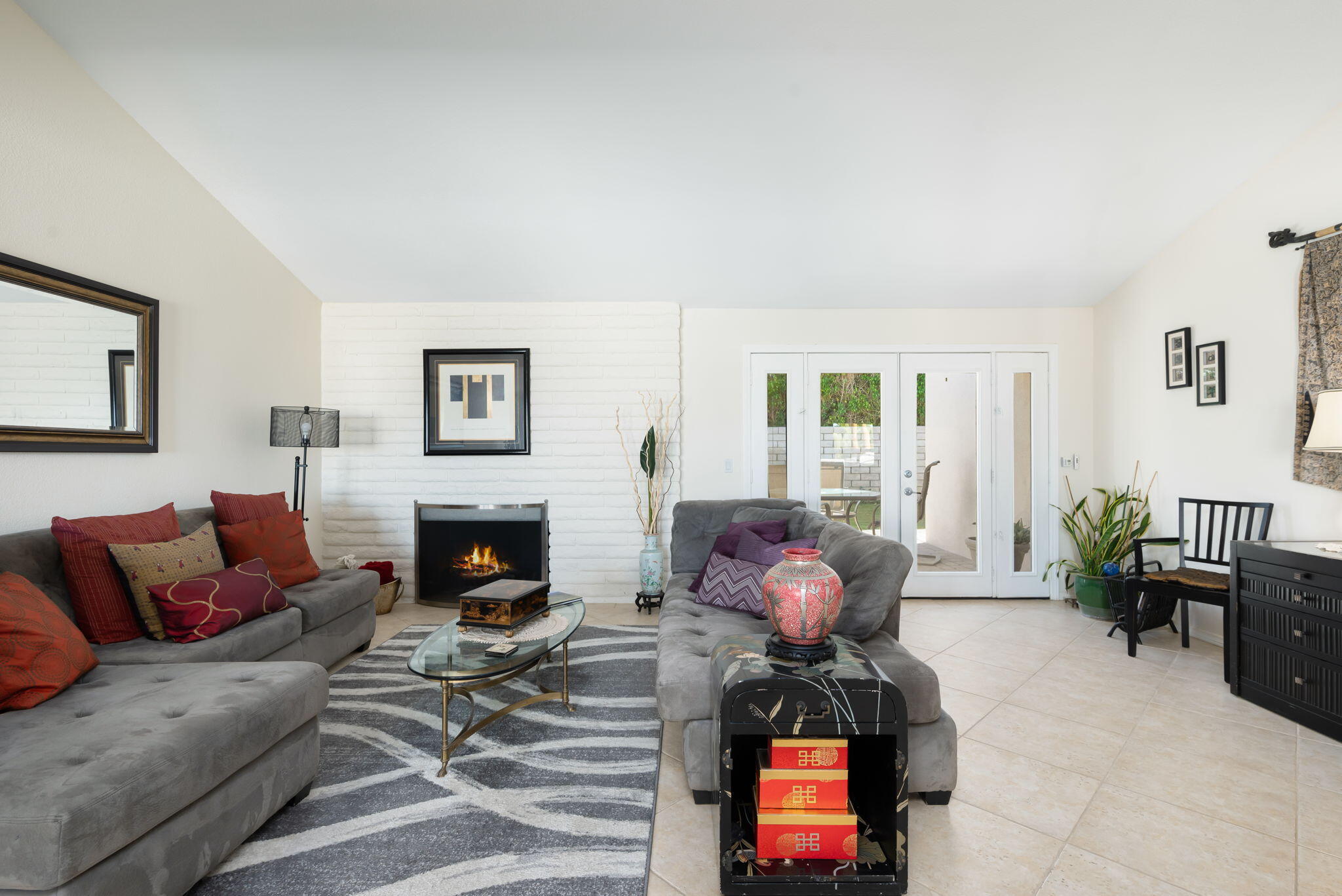 73535 Haystack Road Palm Desert, CA 92260 - Photo 20 of 47 a living room with furniture and a fireplace