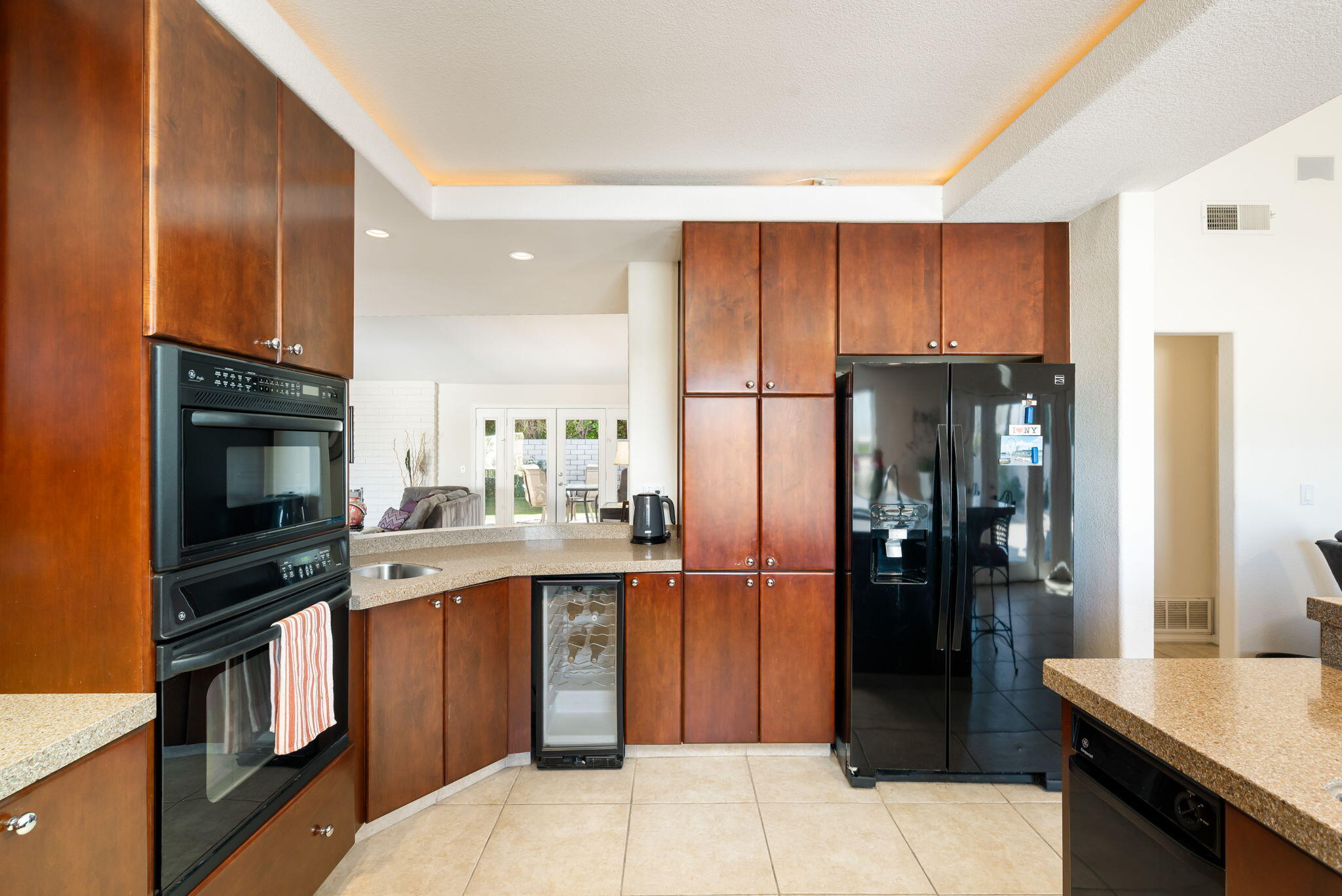 73535 Haystack Road Palm Desert, CA 92260 - Photo 2 of 47 a kitchen with stainless steel appliances granite countertop a refrigerator a stove and a sink