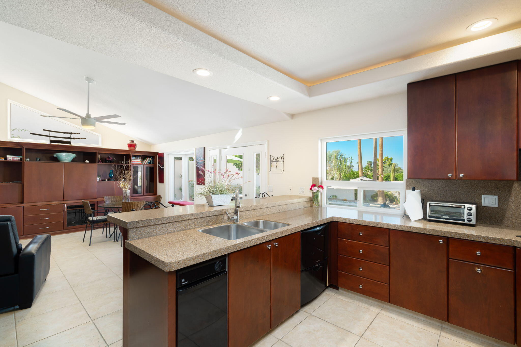 73535 Haystack Road Palm Desert, CA 92260 - Photo 30 of 47 a kitchen with a sink a counter and cabinets