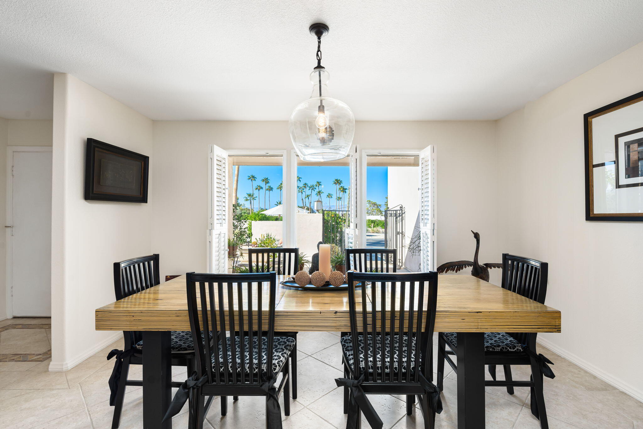 73535 Haystack Road Palm Desert, CA 92260 - Photo 3 of 47 a view of a dining room with furniture window and wooden floor