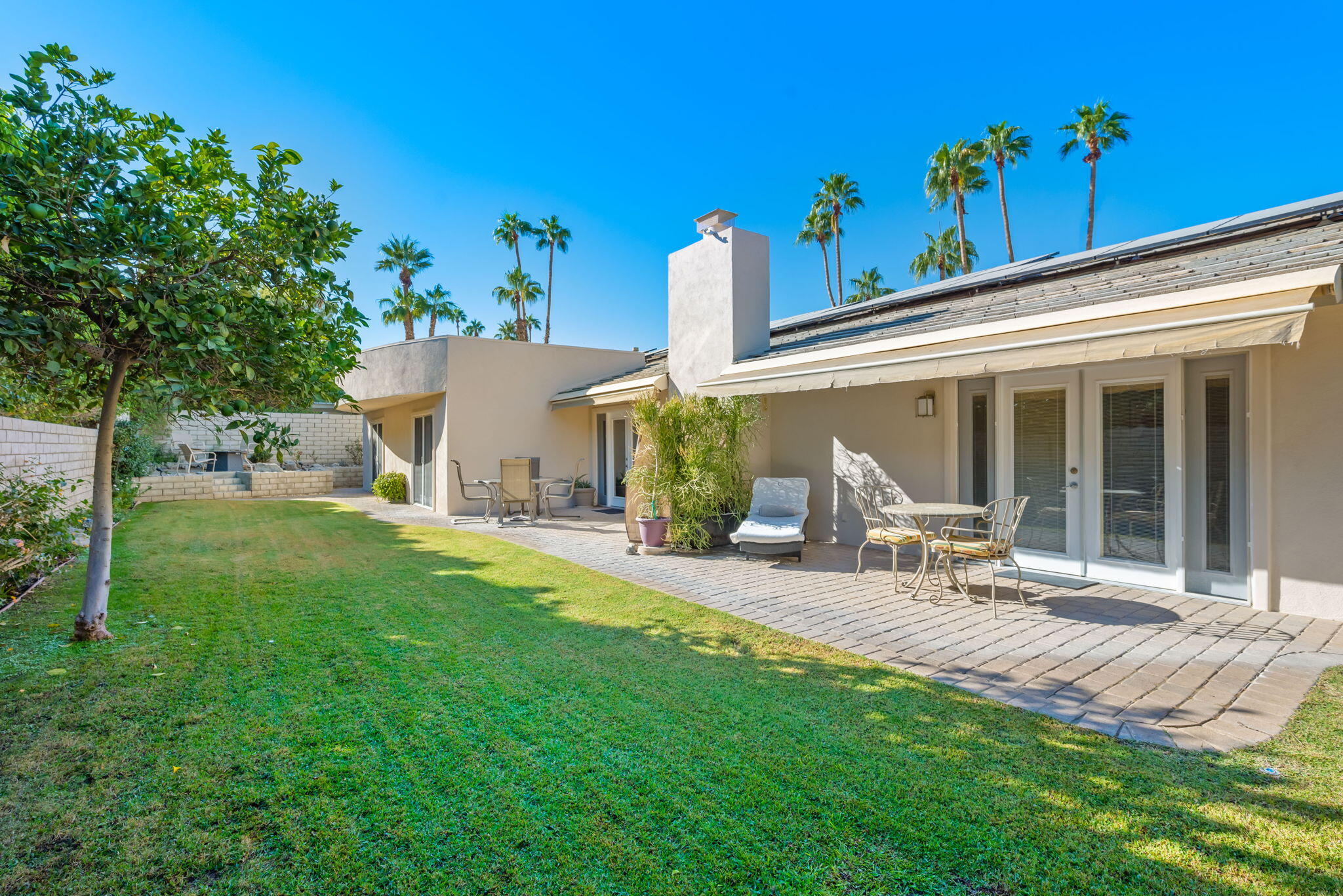 73535 Haystack Road Palm Desert, CA 92260 - Photo 36 of 47 a view of a house with backyard and sitting area