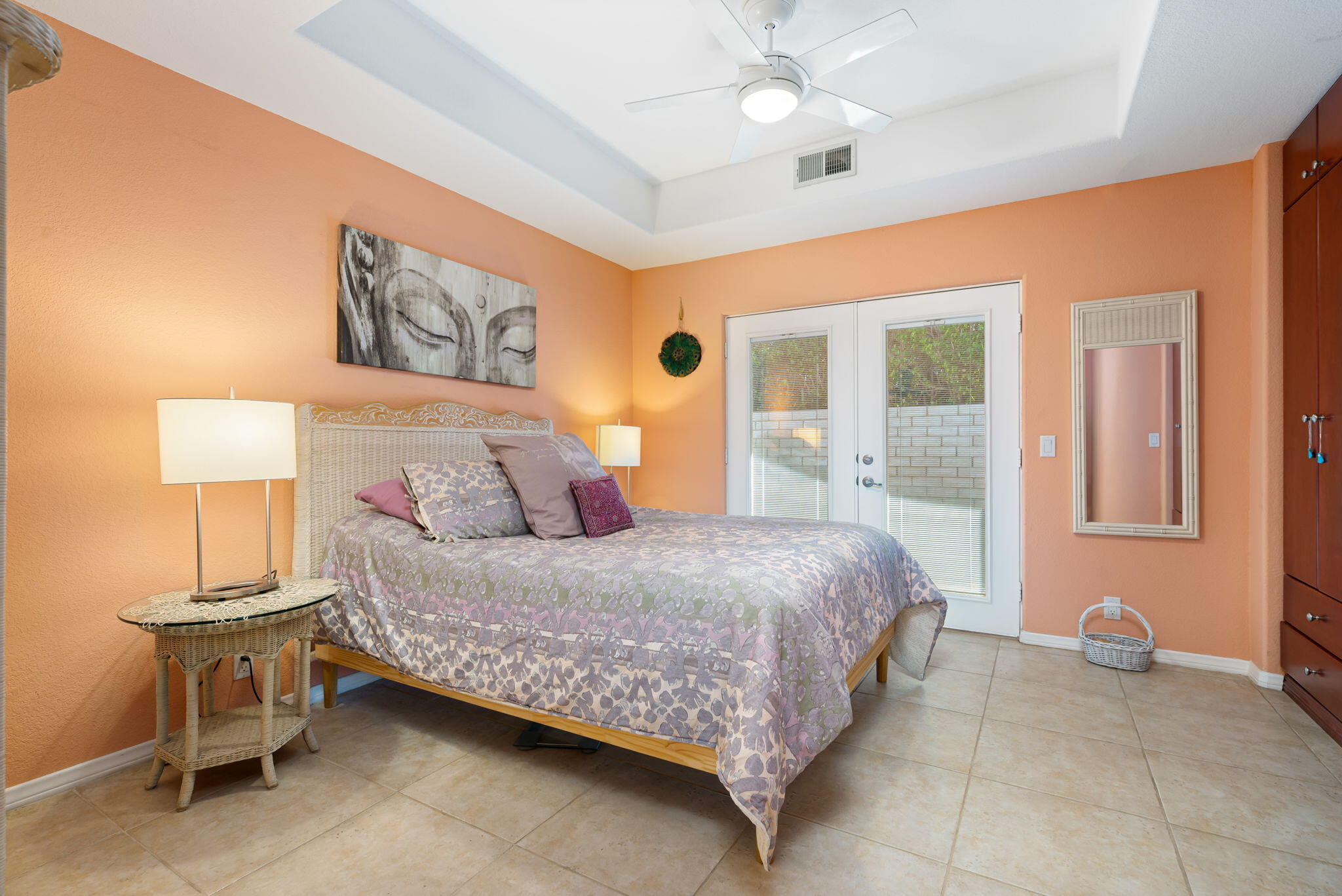 73535 Haystack Road Palm Desert, CA 92260 - Photo 43 of 47 a bedroom with a bed and a chandelier