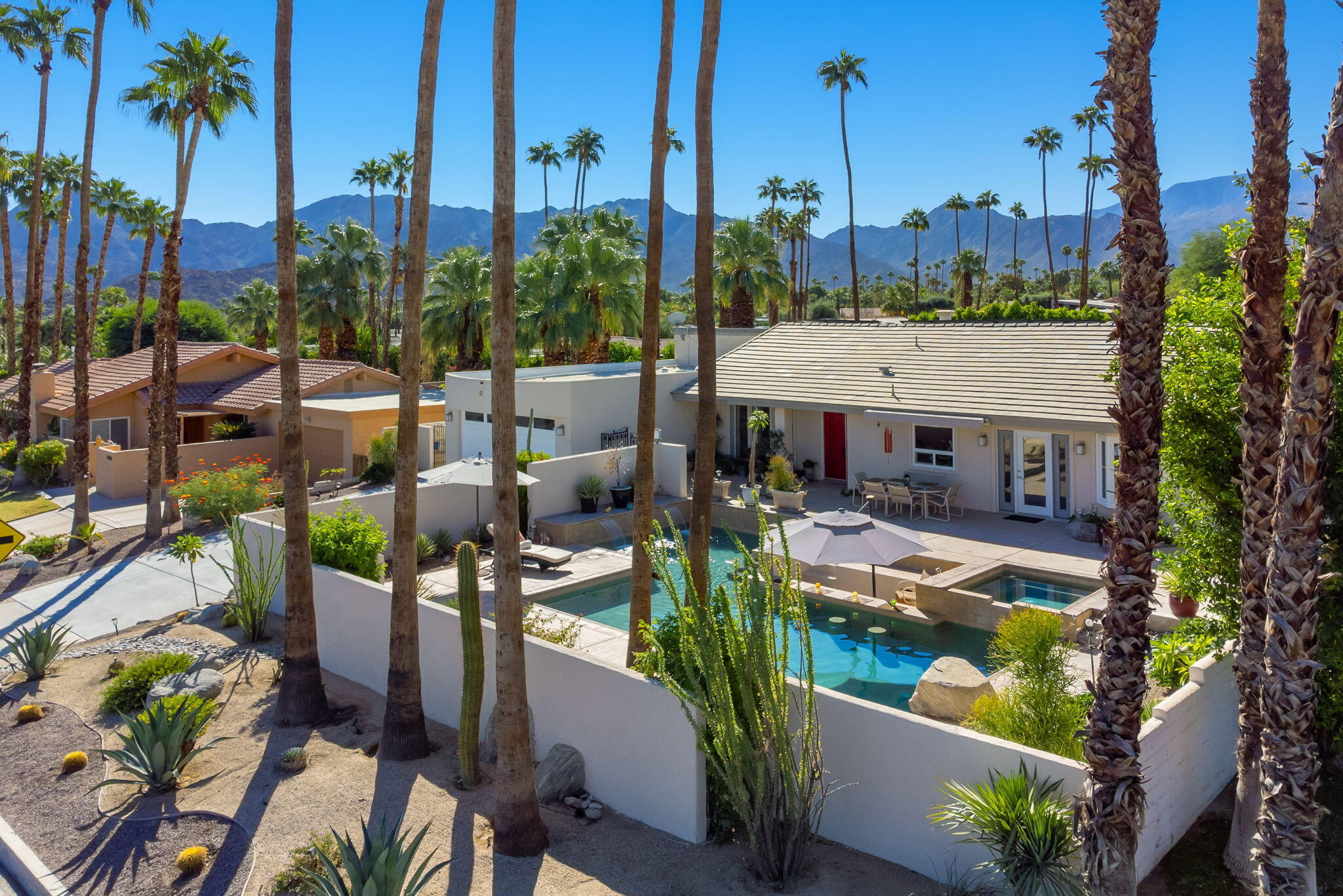 73535 Haystack Road Palm Desert, CA 92260 - Photo 7 of 47 a view of a patio with chairs and a table