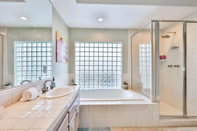 a living room with furniture fireplace and a large window