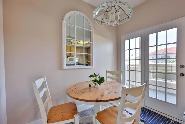 a living room with furniture flat screen tv and wooden floor