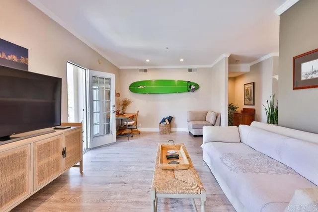 a bedroom with two beds and a large window