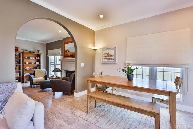 a bedroom with bed and wooden floor