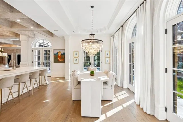 a bathroom with a granite countertop toilet a sink and a mirror