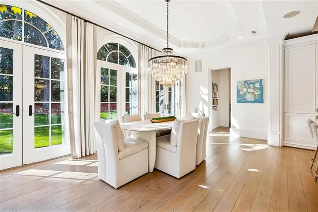 a living room with furniture a large window and a fireplace