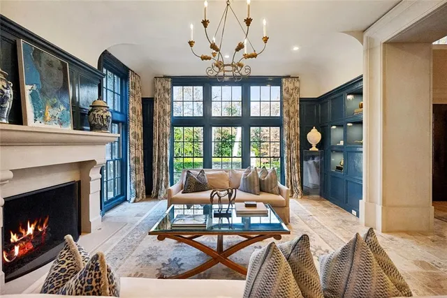 a spacious bedroom with a bed and a window