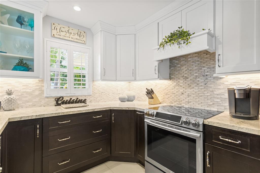 1650 Northeast 27th Avenue Pompano Beach, FL 33062 - Photo 19 of 90 a kitchen with a sink and a stove
