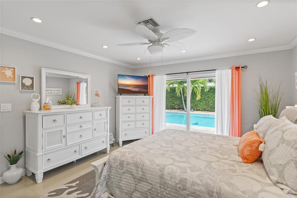 1650 Northeast 27th Avenue Pompano Beach, FL 33062 - Photo 24 of 90 a bed room with a bed and a window