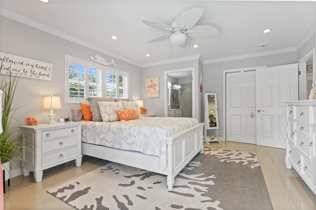 1650 Northeast 27th Avenue Pompano Beach, FL 33062 - Photo 27 of 90 a bedroom with a large bed and a window