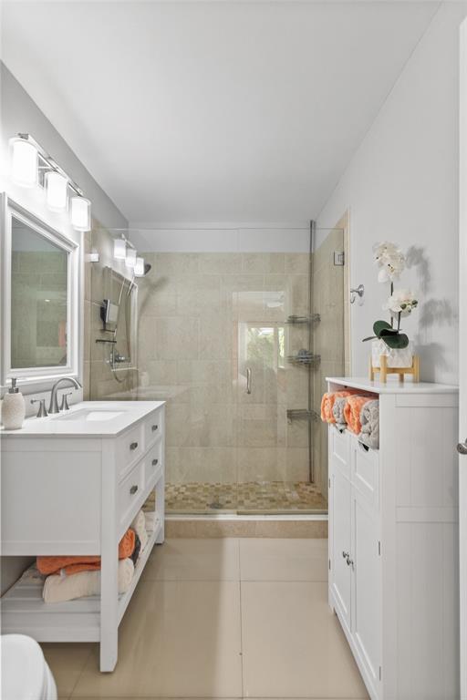 1650 Northeast 27th Avenue Pompano Beach, FL 33062 - Photo 30 of 90 a bathroom with a bathtub sink mirror and shower