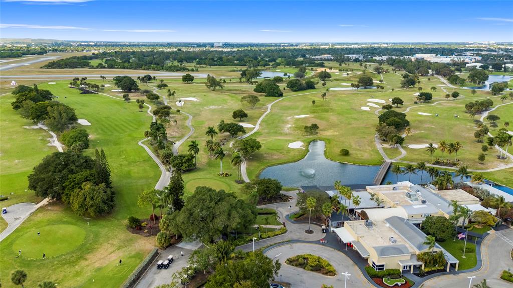 1650 Northeast 27th Avenue Pompano Beach, FL 33062 - Photo 83 of 90 an aerial view of residential houses with outdoor space and trees
