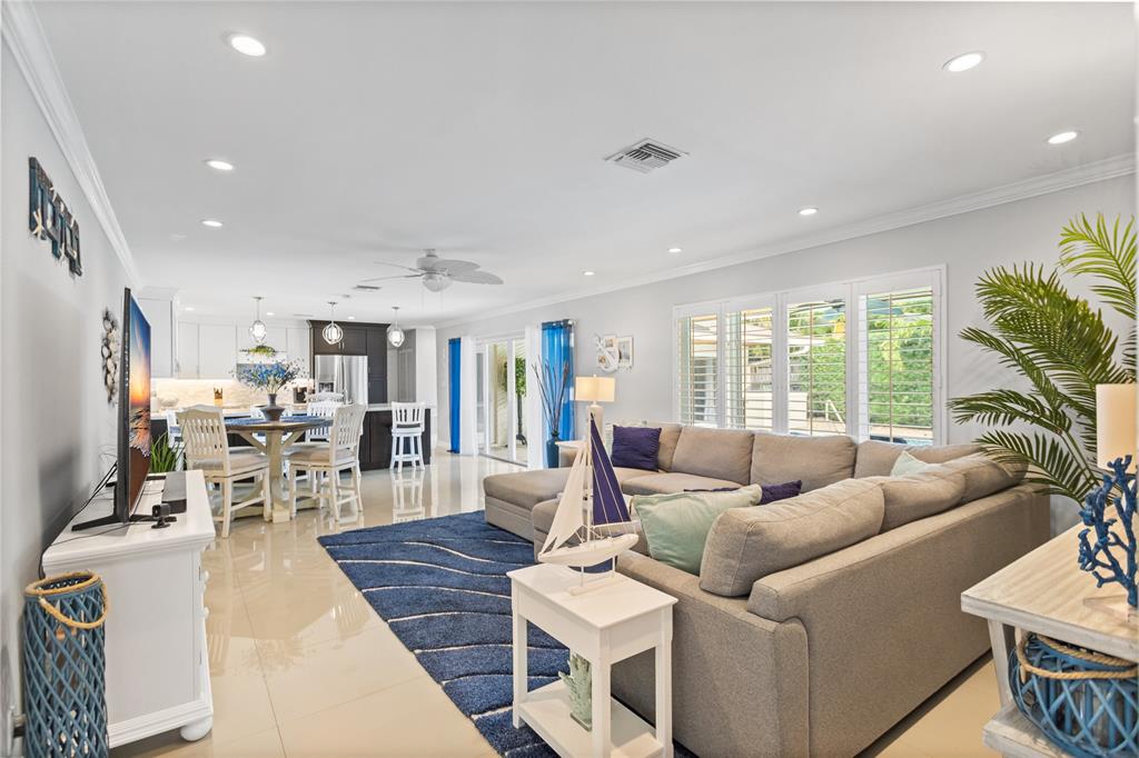 1650 Northeast 27th Avenue Pompano Beach, FL 33062 - Photo 10 of 90 a living room with furniture and a large window