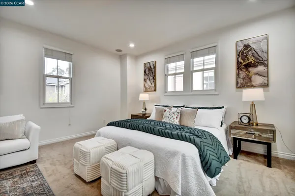 a bedroom with bed and window