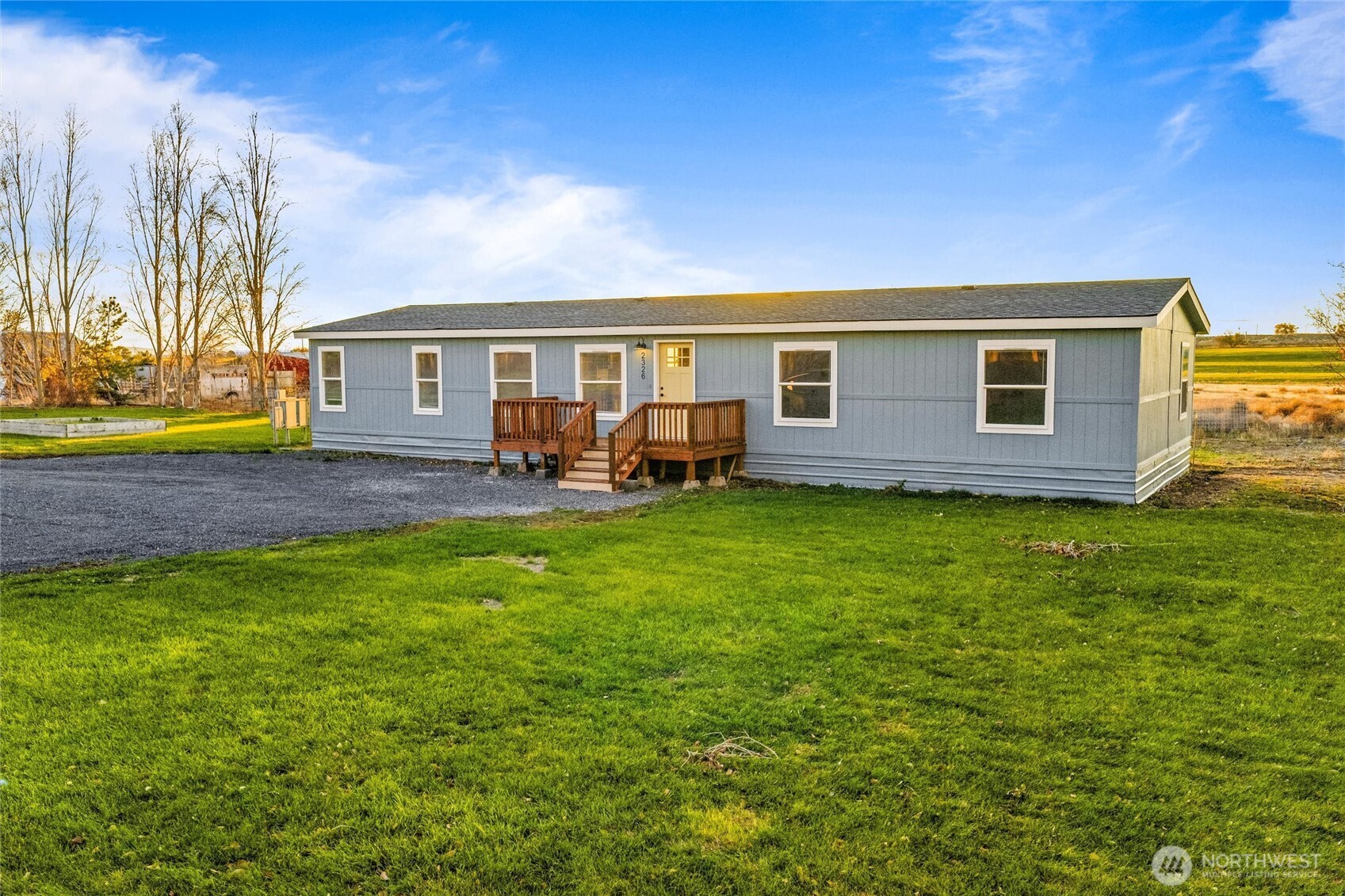 2326 Stoneridge Road Northeast Moses Lake, WA 98837 - Photo 1 of 37 a house view with a garden space