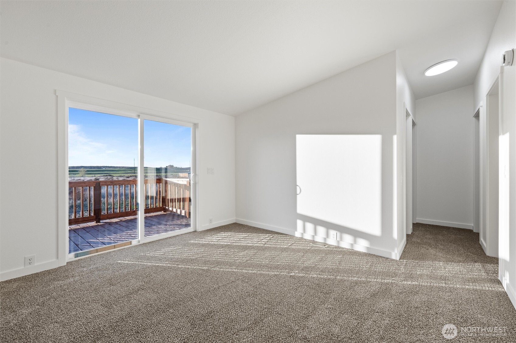 2326 Stoneridge Road Northeast Moses Lake, WA 98837 - Photo 19 of 37 an empty room with furniture and a window