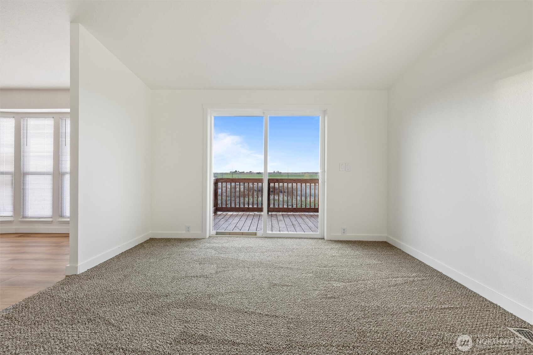2326 Stoneridge Road Northeast Moses Lake, WA 98837 - Photo 27 of 37 an empty room with sliding glass door