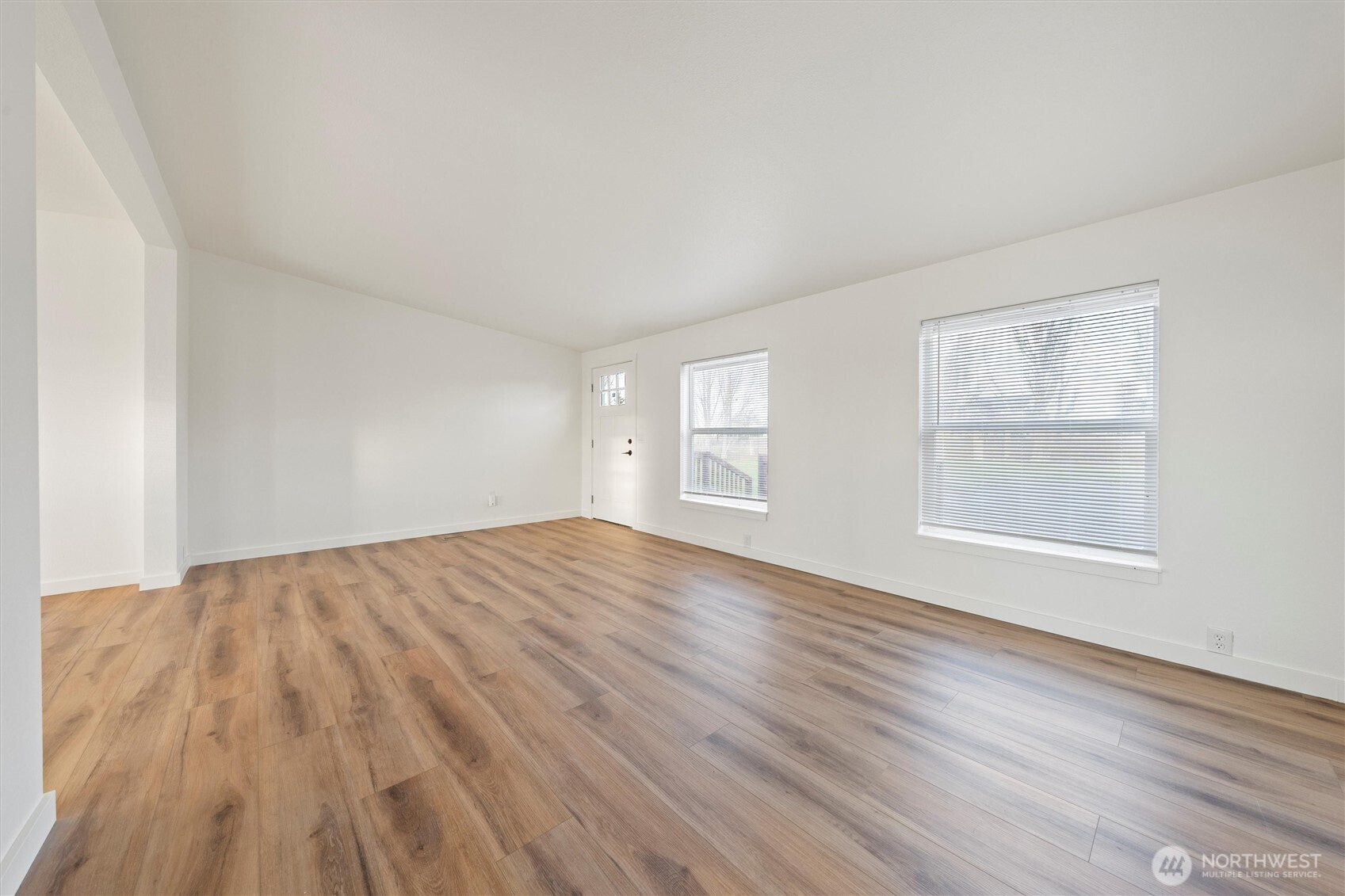 2326 Stoneridge Road Northeast Moses Lake, WA 98837 - Photo 28 of 37 an empty room with wooden floor and windows