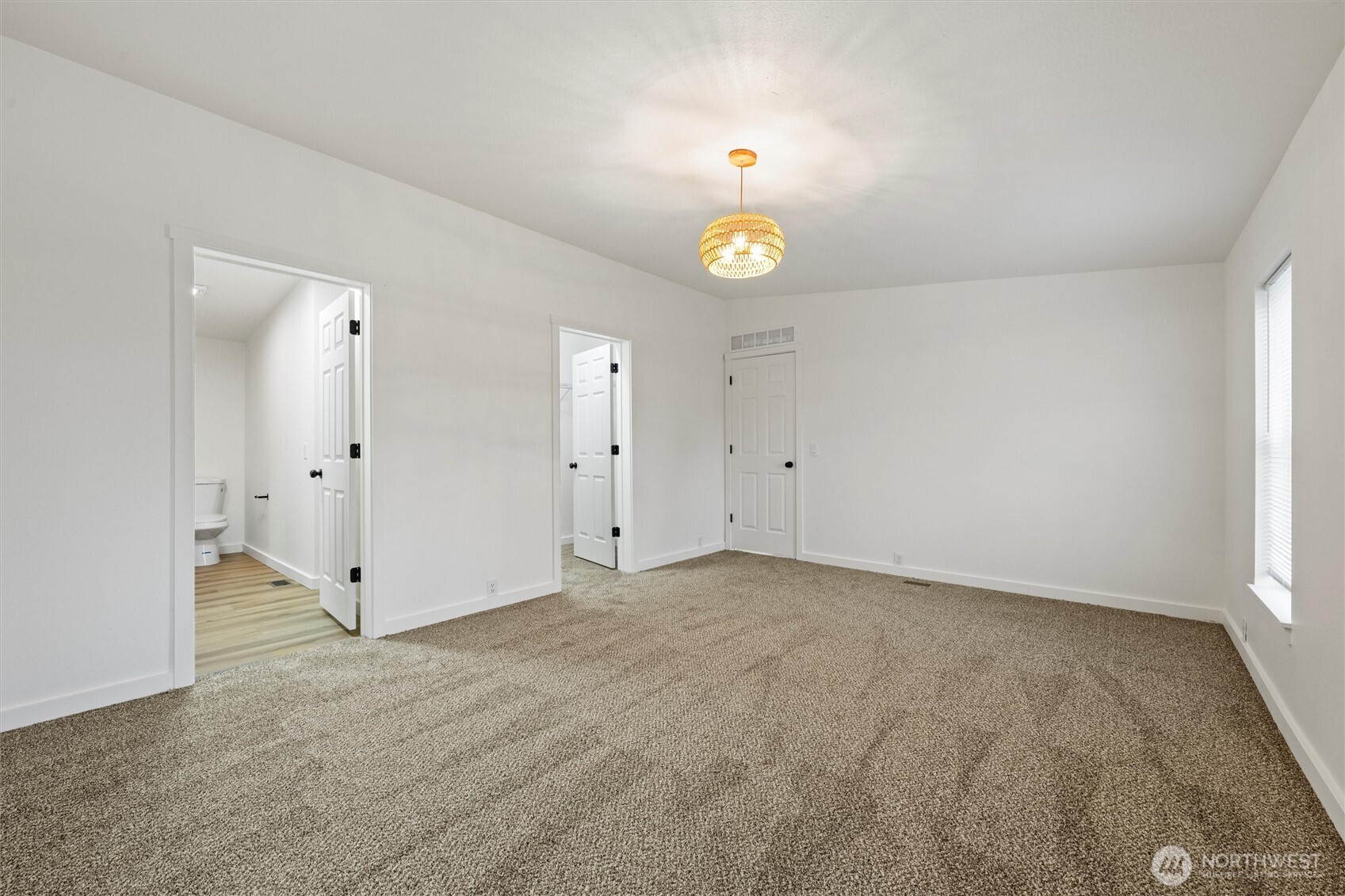 2326 Stoneridge Road Northeast Moses Lake, WA 98837 - Photo 31 of 37 an empty room with window and wooden floor