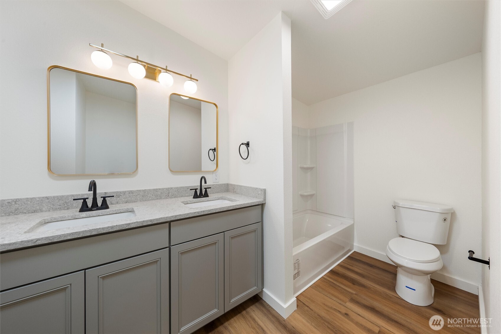 2326 Stoneridge Road Northeast Moses Lake, WA 98837 - Photo 32 of 37 a bathroom with a granite countertop sink toilet and a mirror