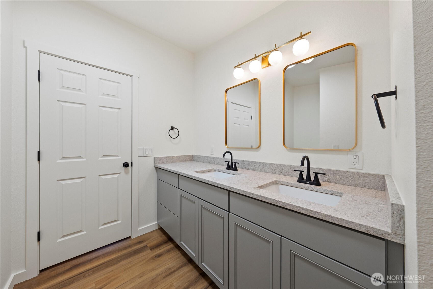 2326 Stoneridge Road Northeast Moses Lake, WA 98837 - Photo 33 of 37 a en suite bathroom with a double vanity sink and mirror