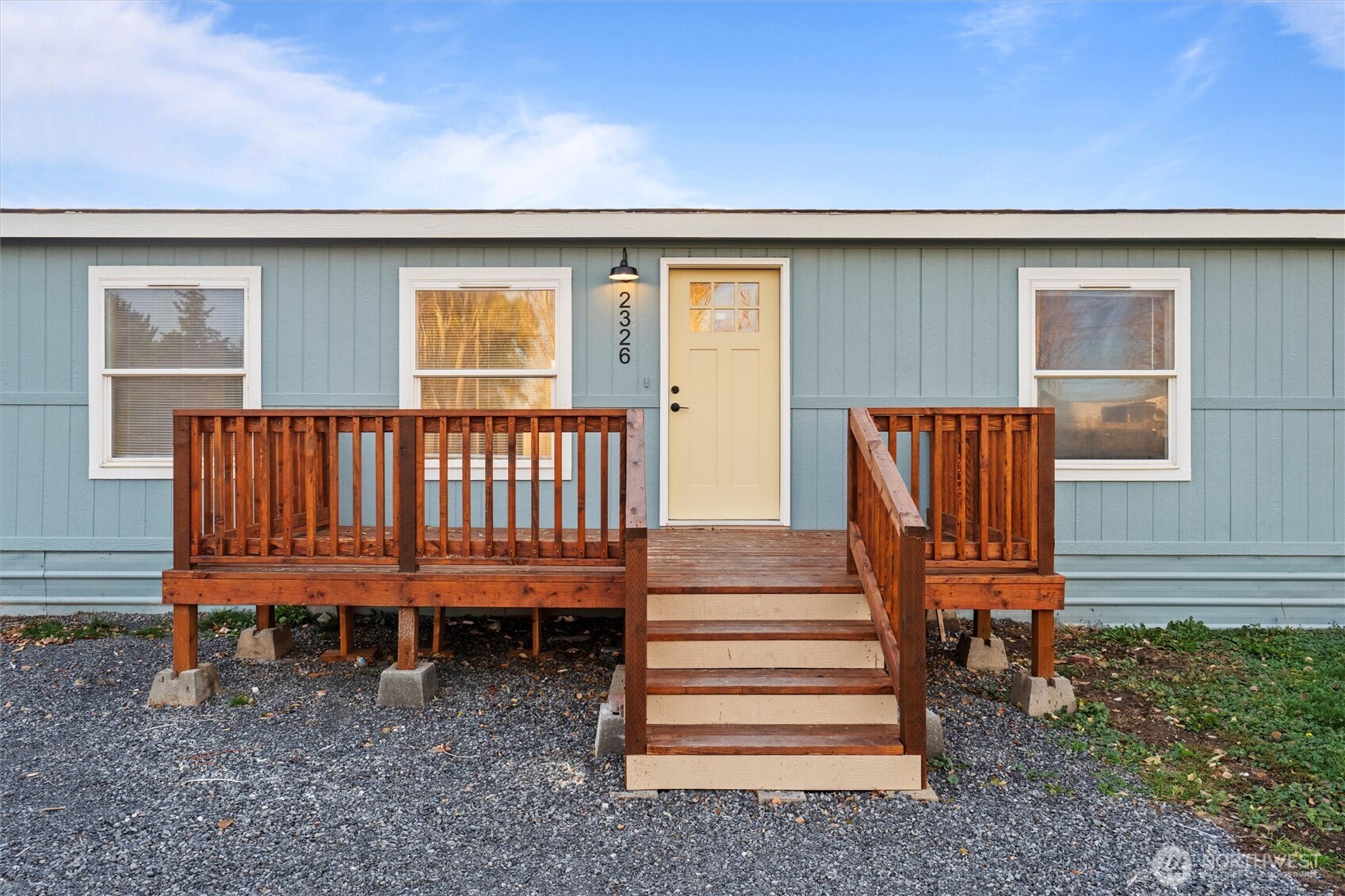 2326 Stoneridge Road Northeast Moses Lake, WA 98837 - Photo 36 of 37 a view of a backyard with wooden fence and a bench
