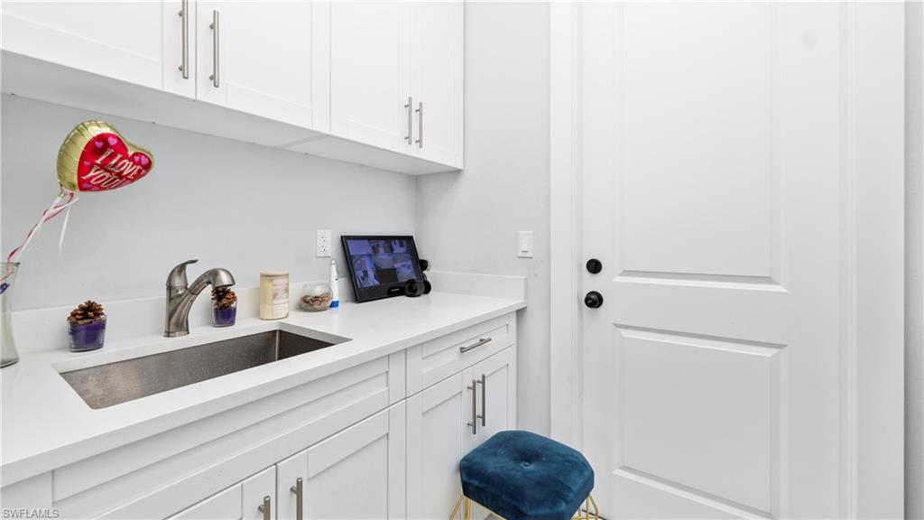 4571 22nd Street Northeast Naples, FL 34120 - Photo 32 of 47 Laundry room with a sink