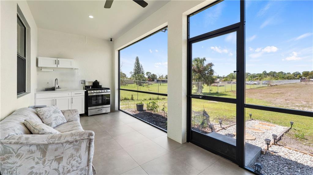 4571 22nd Street Northeast Naples, FL 34120 - Photo 33 of 47 Sunroom featuring a sink and recessed lighting