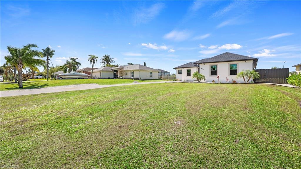 4571 22nd Street Northeast Naples, FL 34120 - Photo 4 of 47 Ranch-style home featuring stucco siding