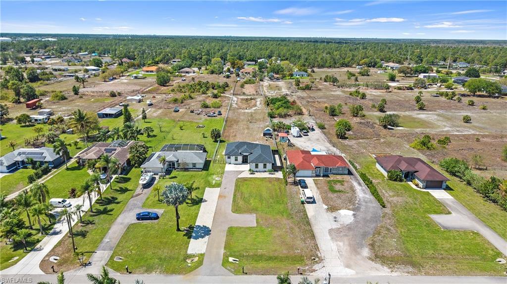 4571 22nd Street Northeast Naples, FL 34120 - Photo 44 of 47 Aerial view of residential area with a forest