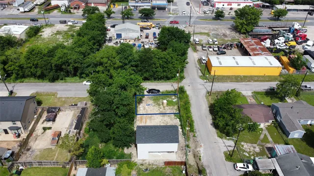an aerial view of residential houses with outdoor space and swimming pool
