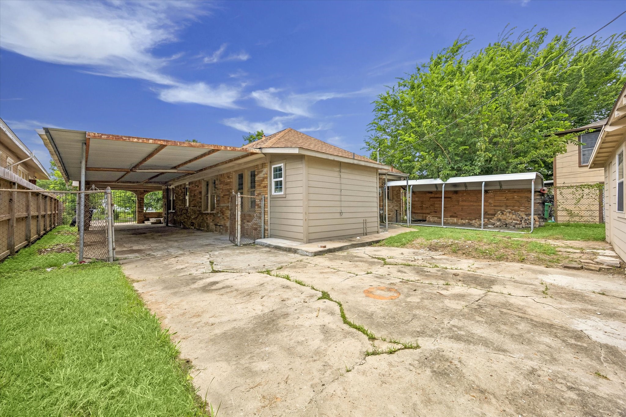 1409 Pearson Street Houston, TX 77023 - Photo 13 of 14 View of the backyard, attached carport and fully fenced