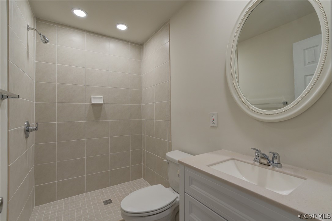 4462 Windmill Point Road White Stone, VA 22578 - Photo 13 of 48 a bathroom with a sink a toilet and a mirror