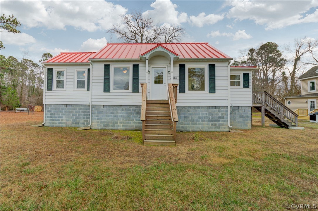 4462 Windmill Point Road White Stone, VA 22578 - Photo 2 of 48 a front view of a house with a yard