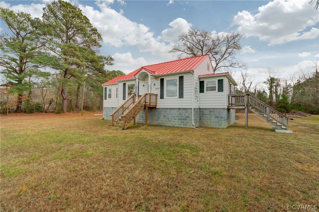 4462 Windmill Point Road White Stone, VA 22578 - Photo 21 of 48 a front view of a house with a yard