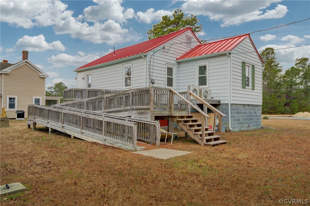 4462 Windmill Point Road White Stone, VA 22578 - Photo 25 of 48 a view of a house with a yard and furniture