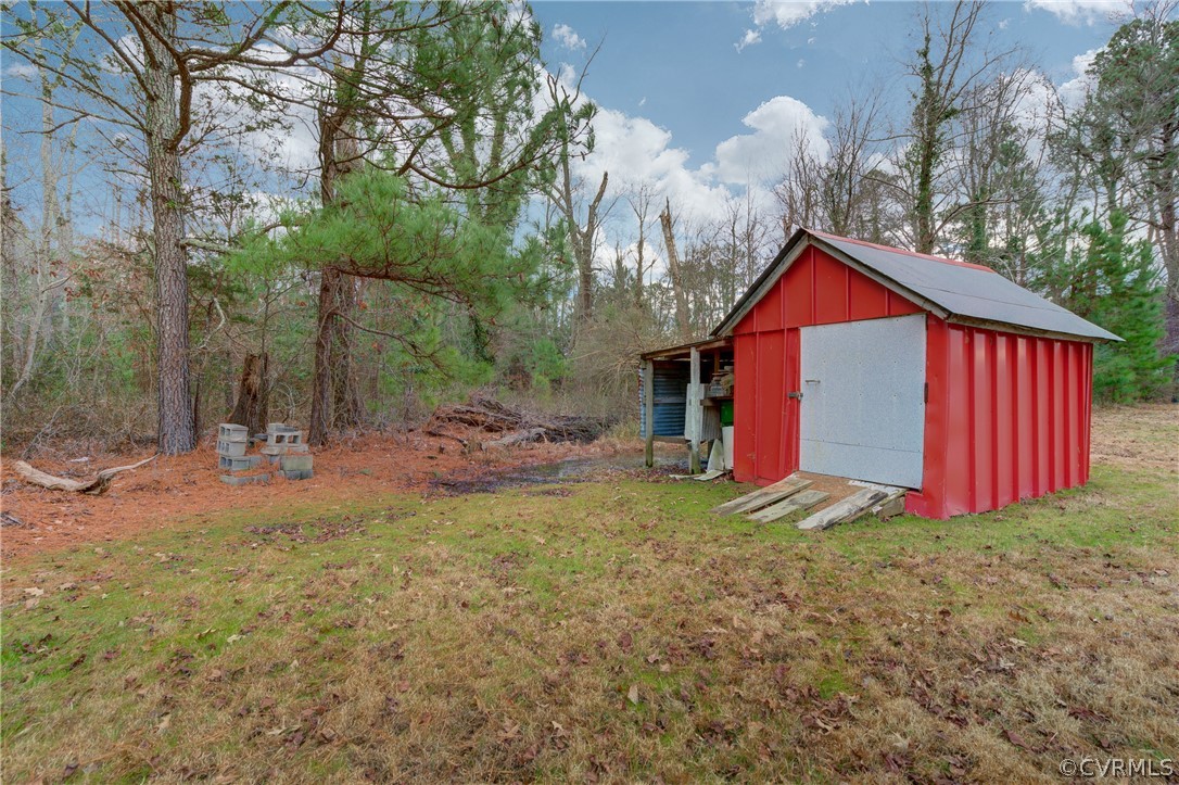 4462 Windmill Point Road White Stone, VA 22578 - Photo 28 of 48 a view of a house with backyard and trees