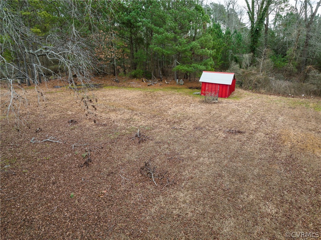 4462 Windmill Point Road White Stone, VA 22578 - Photo 44 of 48 a view of a dry yard with a tree