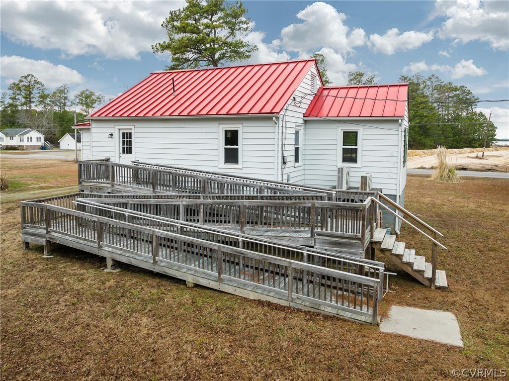 4462 Windmill Point Road White Stone, VA 22578 - Photo 46 of 48 a front view of a house with a garden