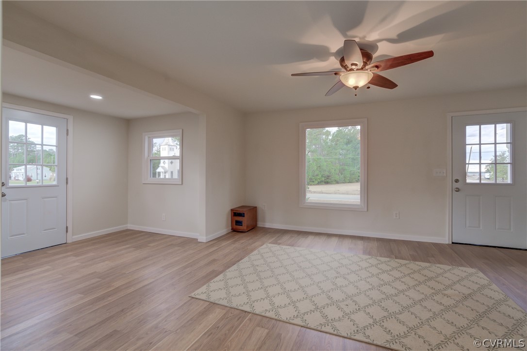 4462 Windmill Point Road White Stone, VA 22578 - Photo 5 of 48 an empty room with windows and fan