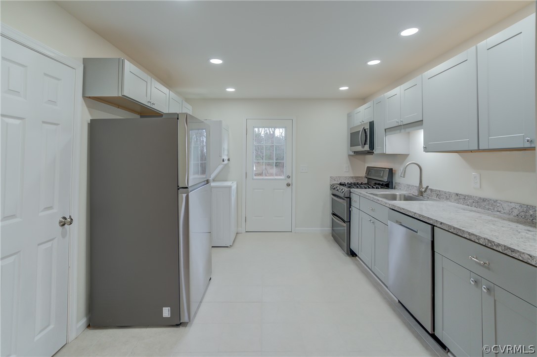 4462 Windmill Point Road White Stone, VA 22578 - Photo 7 of 48 a kitchen with stainless steel appliances granite countertop a refrigerator and a sink