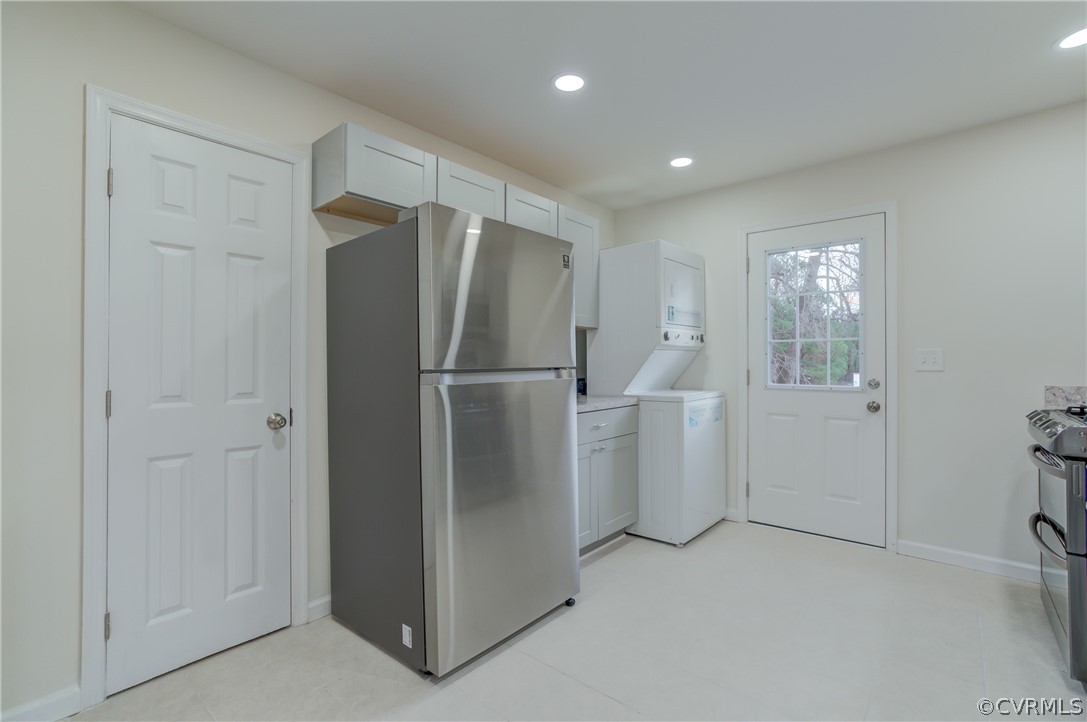4462 Windmill Point Road White Stone, VA 22578 - Photo 8 of 48 a view of a kitchen with refrigerator and microwave