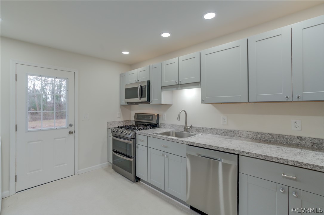 4462 Windmill Point Road White Stone, VA 22578 - Photo 9 of 48 a kitchen with appliances cabinets and a sink