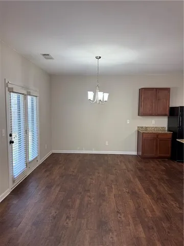 a view of a kitchen with a sink dishwasher and a microwave oven