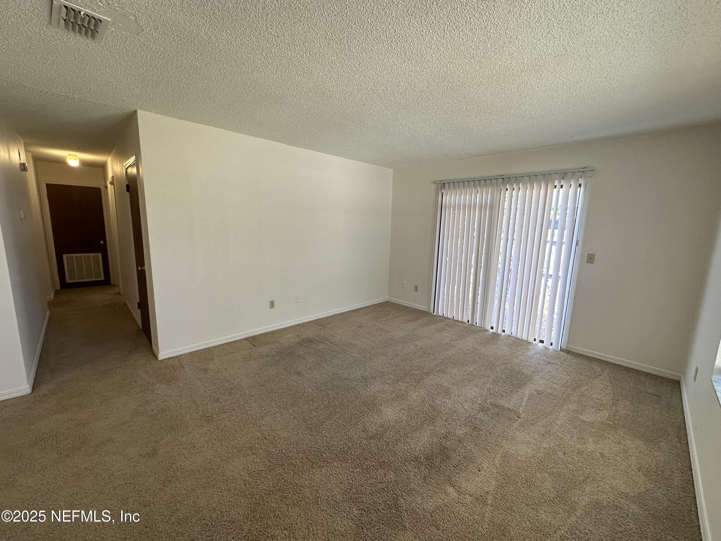 2934 Shelby Drive Orange Park, FL 32073 - Photo 6 of 6 a view of an empty room and a window