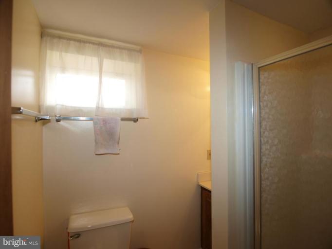 2600 Dawson Avenue Silver Spring, MD 20902 - Photo 11 of 24 a bathroom with a shower and a toilet