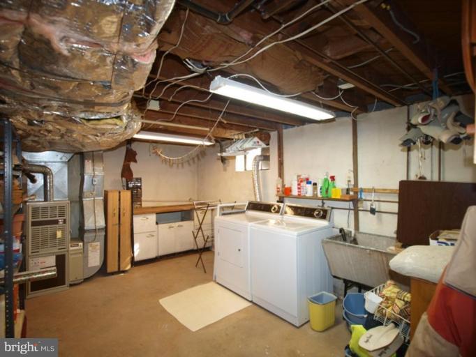 2600 Dawson Avenue Silver Spring, MD 20902 - Photo 12 of 24 a storage room with washer and dryer